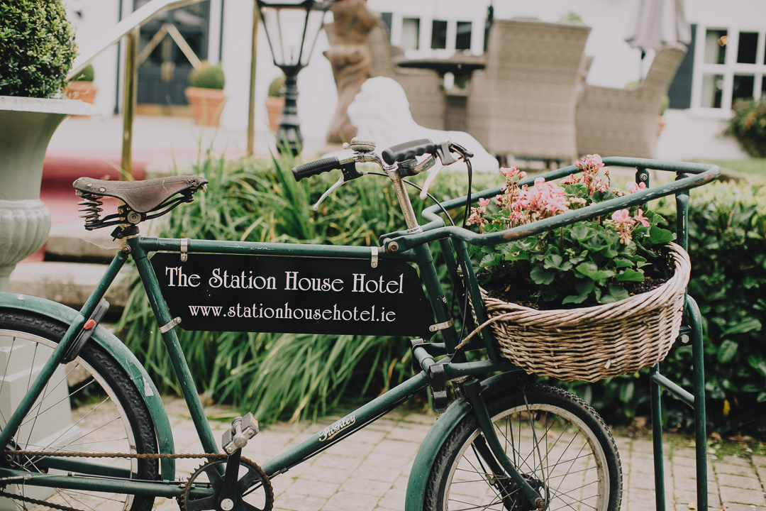 old bicycle with flower pot at the station house hotel