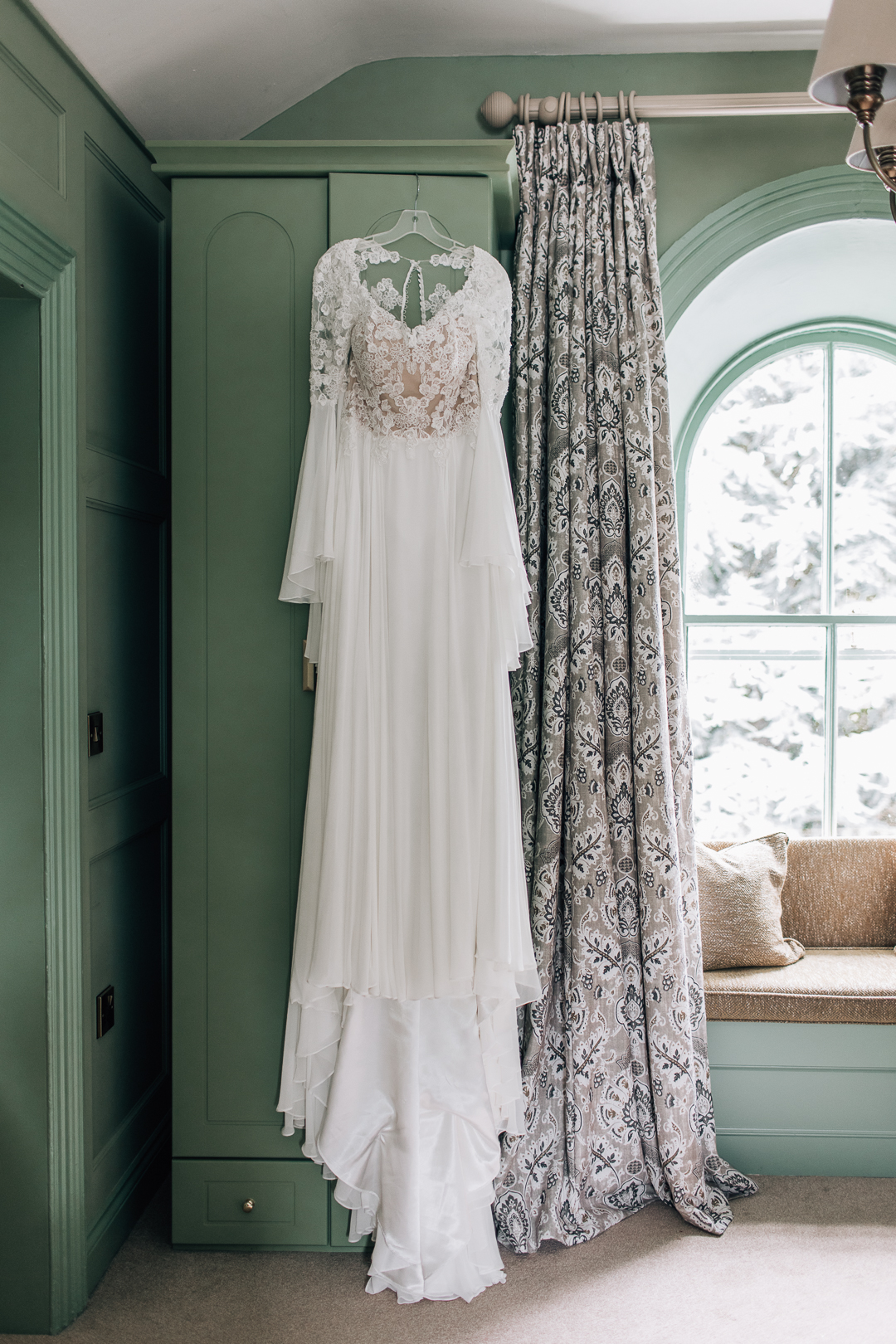 wedding dress hanging on the wardrobe